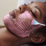 woman getting a facial treatment at a beauty spa